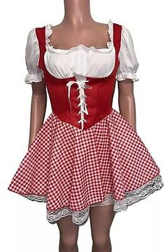 a mannequin wearing a red and white dress with checkers on the skirt