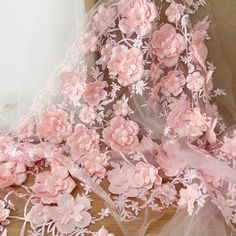 pink flowers and sheer fabric on a table