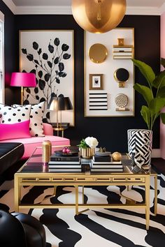 a black and white living room with pink couches, gold coffee table and art on the wall