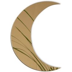 an image of a crescent shaped mirror with grass in the foreground and white background