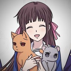 a girl holding two cats and a dog