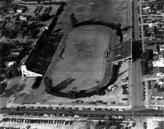 an aerial view of a stadium and parking lot