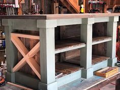 the shelves are made out of pallets and have been built into an area for storage