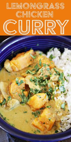 a blue bowl filled with chicken curry and rice