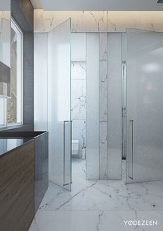 a bathroom with marble floors and walls