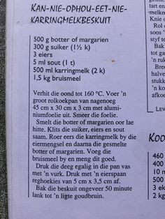 an open book with instructions on how to make pancakes in german and english, sitting on a table