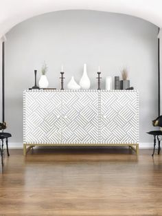 a white and gold sideboard in a living room