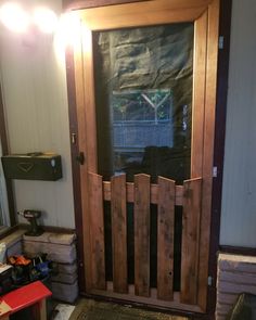 a wooden door with a screen on it