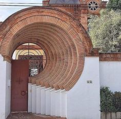 an arched doorway in the side of a building