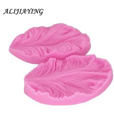 two pink leaves shaped soaps sitting on top of each other