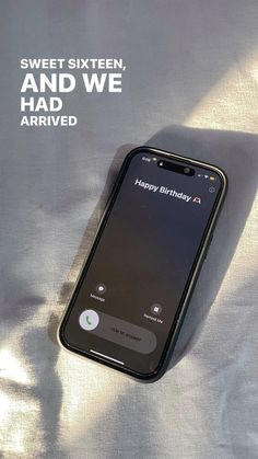 an iphone is laying on a sheet with the text happy birthday to sweet sixteen, and we had arrived