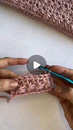 someone is crocheting the ends of a blanket