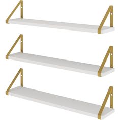 three white shelves with gold handles on each shelf, one is empty and the other has two