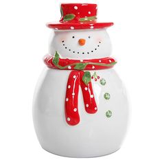 a white ceramic snowman with red hat and scarf