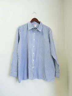 Good used condition. Size tag has faded, kindly make sure to review the measurements listed below.  American Sweetheart Vintage 90s 65% Polyester, 35% cotton 26 inches pit to pit  34 inch shoulders 28 inches long 24 inch sleeves womens, striped, buttondown, button, up, down, buttonup, white, blue, classic, professional, career, preppy, careerchic, businessprofessional, plussize, 2x, xxl, xl, vintage, 90s, retro, oversized Striped Button Up, Blue And White Button Down Shirt Outfit, American Sweetheart, White Summer Shirt, Sixth Form, Blue Button Up Shirt, Blue Striped Shirt