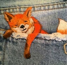 an image of a stuffed animal that is in the pocket of someone's jeans