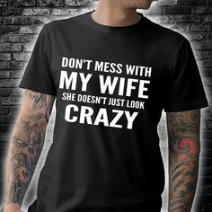 Wife and husband don't mess with my wife she doesn't just look crazy T Shirt Hoodie Sweater H97 available in T-shirt, hoodie, tank top, longsleeve, multi color and size S M L XL XXL 3XL 4XL 5XL. Shipping from the US. Easy 30 day return policy - Shop now! 6.1-ounce, 100% cotton .Double-needle neck, sleeves and hem; Roomy Unisex Fit. Ash is 99% cotton, 1% poly; Sport Grey is 90% cotton, 10% poly; Dark Heather is 50% cotton, 50% polyester .Decoration type: Digital Print. Made by Gildan Ex Wife Shirt, Husband Wife Tshirts, My Wife Tshirt, Spoiled Wife Shirt, My Wife Is Dope Shirt, I Love My Wife Tee Shirt, Wife And Husband, Hoodie Sweater, My Wife