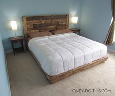 a large bed sitting in the middle of a bedroom