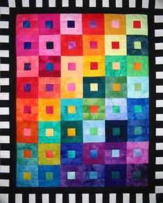 a multicolored quilt with squares on it