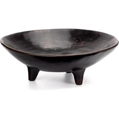 a black bowl sitting on top of a wooden stand