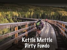 two people riding bikes on a bridge with the words kettlel mettle dirtyy fundo