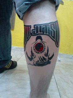 a man's leg with a tattoo on it