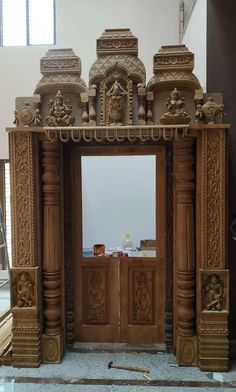 an intricately carved wooden entrance to a building