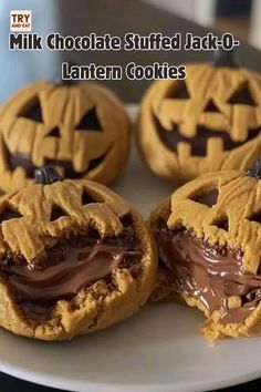 chocolate stuffed jack - o - lantern cookies on a white plate with the words milk chocolate stuffed jack - o'lanterns