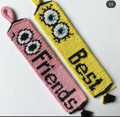 two beaded bookmarks with the words'free hugs'and an eyeball on them