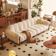 a living room filled with furniture and decor