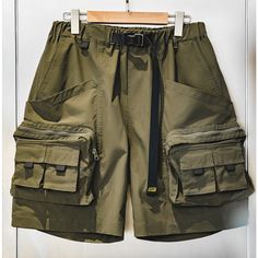 Our 9 POCKETS AMEKAJI CARGO SHORTS are designed for maximum comfort and convenience. This military-style short features utility-enhancing nine pockets and is made using durable, functional fabrics. These shorts feature belt buckle locks, webbing, and Velcro for added durability and attractiveness. With a short, wide version for improved matching and casual comfort, these stylish shorts will fit all your needs. Washing Instructions A washing machine can be used, do not dry in the sun to cause dis Suits For Short Men, Y2k Sweatpants, Military Shorts, Suit Shorts, Streetwear Pants, Mens Shorts Summer, Work Suits, Outdoor Summer, Mens Trends