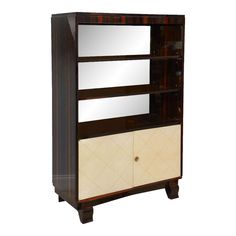 a brown and white bookcase with mirrors on it's sides, against a white background