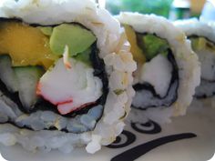 sushi rolls with cucumber, avocado and other vegetables on them