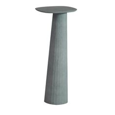 a tall grey concrete pedestal on a white background