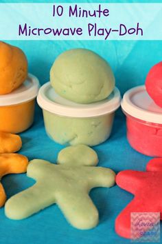 there are several different types of play doughs in plastic containers and on the table