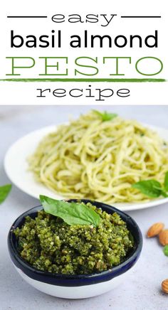 basil pesto pasta in a white bowl with almonds and basil leaves on the side