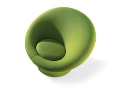 a green chair sitting on top of a white floor