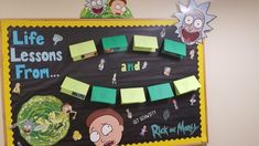 a bulletin board with post it notes on it and cartoon characters hanging from the back