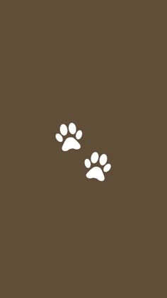 two dogs paw prints on a brown background