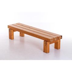 a wooden bench sitting on top of a white floor