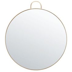 a round mirror on a white background with a gold ring around the edges and bottom