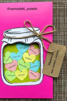 a card with hearts in a mason jar