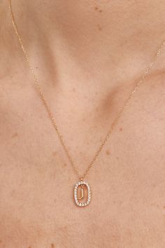 Diamonds and Gold Letter J Necklace. Initial J necklace in solid yellow gold, circled by 0.31 carats lab-grown diamonds. Metal: 18K Solid Yellow Gold (100% recycled gold) Stones: Lab-Grown diamonds (FVS2 quality) Total Carat Weight: 0.31 Number of Diamonds: 22 Diamonds Diameter 1.5 mm Oval Measurements: 10.5x15 mm J Locket Letter J, J Necklace Initial, Letter J Necklace, Initial J, J Necklace, Gold Letter Necklace, Necklace Initial, Gold Letter, Letter J