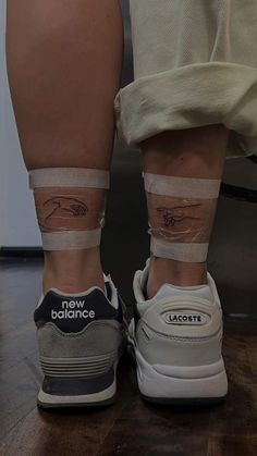 the legs and ankles of a person with bandages on them