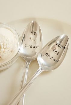 two spoons with some ice cream on them