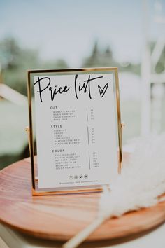 a price list sitting on top of a wooden table