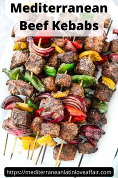 meat kebabs on skewers with peppers and onions