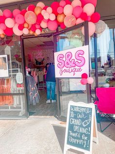 there is a sign that says s & s boutique in front of the storefront