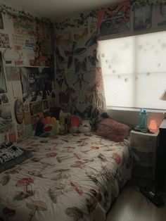 a bed room with a neatly made bed next to a window