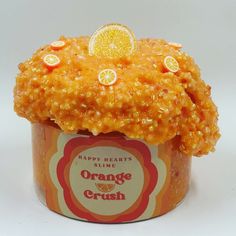 an orange crumb cake in a cup on a white background with words happy heart's orange crush